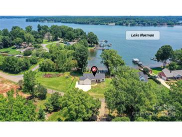 Lake Norman property with stunning waterfront views, sprawling lawn, and a charming single-Gathering home at 4980 Kiser Island Rd, Terrell, NC 28682