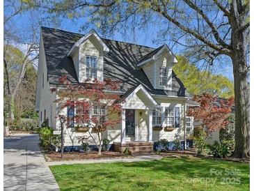 Charming home featuring classic architecture, a well-maintained lawn, and mature trees at 3005 Somerset Dr, Charlotte, NC 28209