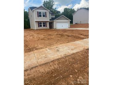 Charming two-story home features a one car garage and is located on a spacious lot at 438 Phifer Rd, Kings Mountain, NC 28086