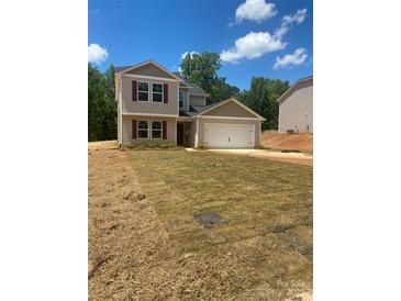 Inviting two-story home with a two-car garage and well-maintained lawn at 438 Phifer Rd, Kings Mountain, NC 28086