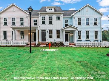 Charming new construction townhomes featuring inviting front porches and well-manicured landscaping at 282 Gilead Rd, Huntersville, NC 28078