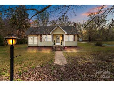 Charming single-story home with a walkway leading to the front door and a well-maintained lawn at 325 Hurley School Rd, Salisbury, NC 28147