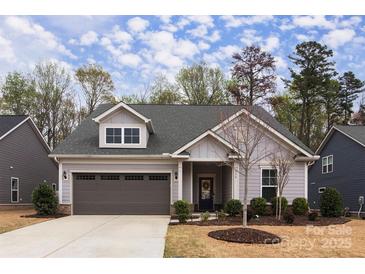 Charming single-Gathering home with a two-car garage and well-manicured landscaping at 938 Moose Trl, Matthews, NC 28104