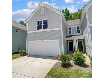 Charming two-story home with a two-car garage and manicured lawn at 14022 Clayborn St, Midland, NC 28107