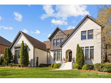 Beautiful exterior elevation showcases the manicured lawn and modern design of this two-story home at 318 Montrose Dr, Waxhaw, NC 28173