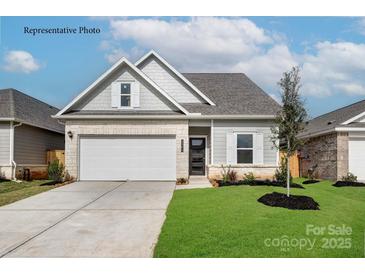 Charming single-Gathering home features a two-car garage, stone accents, and well-maintained landscaping at 1650 Troon Dr, Salisbury, NC 28144