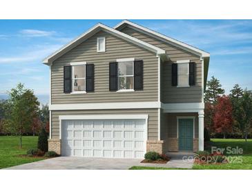 Charming two-story home featuring neutral siding, black shutters, and a two-car garage at 135 Bellina Dr # 36, York, SC 29745