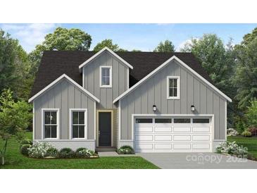Charming two-story home with a gray exterior, white trim, and a two-car garage at 4126 Eastover Glen Rd # 0317, Charlotte, NC 28269