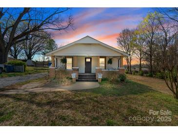 Charming single-story home with a welcoming front porch and freshly painted exterior and landscaping at 1545 7Th Avenue Sw Dr, Hickory, NC 28602