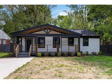Charming bungalow with a covered porch, black trim, and freshly painted white brick at 1812 Lot 2 Anderson St, Charlotte, NC 28205