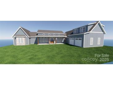 New construction of a beautiful two-story home with blue siding and a two-car garage on a lush green lawn at 2334 Bridgewater Rd # 6, Rock Hill, SC 29730