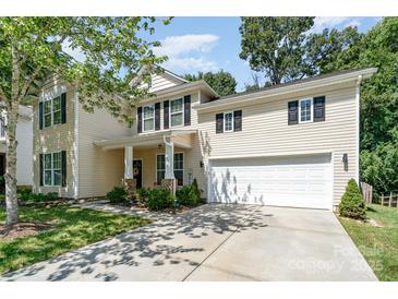 Beautiful two-story home with a welcoming front porch, black shutters, and a well-maintained lawn at 3009 Early Rise Ave, Indian Trail, NC 28079