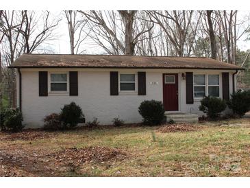 Charming single-story home with painted brick exterior and classic shutters, perfect for comfortable living at 508 S Jackson Ave, Waxhaw, NC 28173