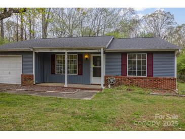 Charming single-story home with blue siding, red shutters, and a covered front porch at 6005 Fringe Tree Dr, Charlotte, NC 28227