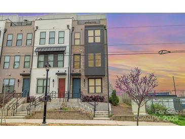 Charming townhomes boast a brick facade with individual entrances and modern architectural details at 631 W Tremont Ave, Charlotte, NC 28203