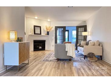 Comfortable living room with fireplace, neutral furniture, and modern accents at 715 21St Ne Ave, Hickory, NC 28601