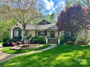 Beautifully landscaped home with a well-manicured lawn and a charming stone walkway leading to the front entrance at 1725 Hannon Farm Rd, Fort Mill, SC 29715