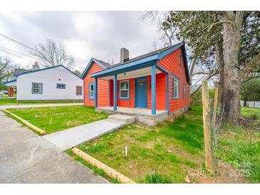 Charming single-Gathering home boasting a vibrant color scheme and inviting front porch at 121 Oak St, Chester, SC 29706