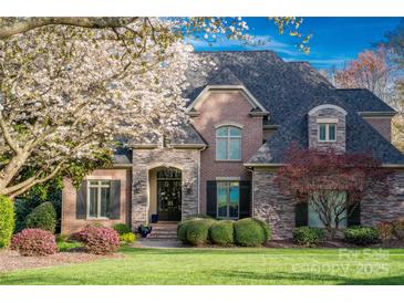 Charming brick home with beautiful stone accents and lush landscaping at 4628 Sierra View Dr, Denver, NC 28037
