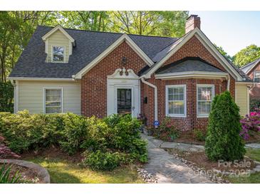 Charming brick home featuring a well-manicured front yard and inviting entrance at 1220 Oakwood Ave, Gastonia, NC 28052