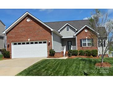 Charming brick and siding home with well-maintained lawn and two-car garage at 5172 Norway Rd, Rock Hill, SC 29732