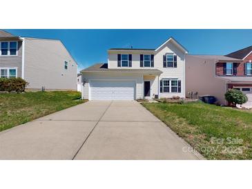 Charming two-story home featuring a two-car garage and well-maintained front lawn at 10848 Tailwater St, Davidson, NC 28036
