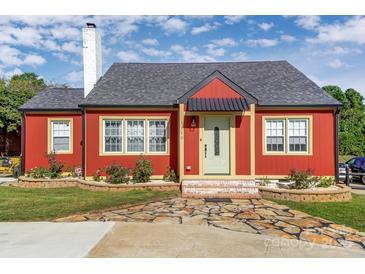 Charming red home featuring a stone walkway, inviting entrance, and well-maintained landscaping at 1110 S New Hope Rd, Gastonia, NC 28054