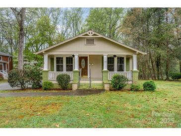 Charming bungalow with inviting front porch, manicured landscaping, and lots of curb appeal at 119 E End Ave, Statesville, NC 28677