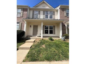 Charming townhome with a welcoming porch and well-maintained front yard at 2006 Cramerton Village Dr # 31-D, Cramerton, NC 28032