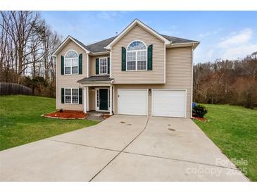 Charming two-story home featuring a two-car garage and well-maintained landscaping at 240 Bluffton Rd, Mooresville, NC 28115