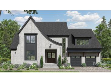 Charming two-story home featuring a stylish white brick facade, a modern black roof, and a well-manicured front yard at 19134 Newburg Hill Rd, Davidson, NC 28036
