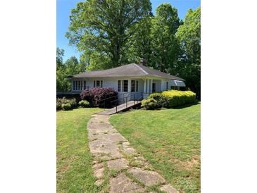 Charming single-story home with landscaped front yard and concrete walkway to the front entrance at 311 33Rd Street Se Dr, Hickory, NC 28602