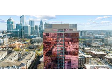 Stunning building with reflective rose colored windows in urban setting featuring cityscape views at 315 Arlington Ave # 705, Charlotte, NC 28203