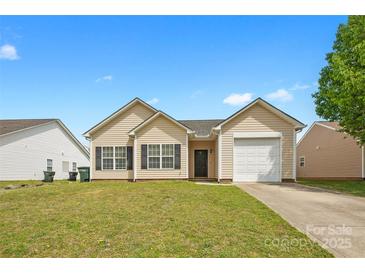 Charming single-story home featuring a well-maintained lawn and attached one car garage at 2659 Captains Watch Ne Rd, Kannapolis, NC 28083
