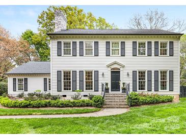 Charming two-story home with well-manicured lawn and classic architectural details at 2912 Wheelock Rd, Charlotte, NC 28211