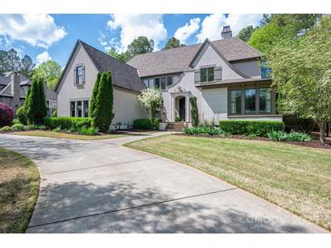 Stately home featuring manicured landscaping, a circular driveway, and a timeless facade at 3160 Ashwood Park Dr, Belmont, NC 28012