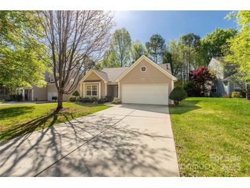 Charming single-story home with a well-maintained lawn and a two-car garage at 3411 Xandra Ct, Indian Land, SC 29707