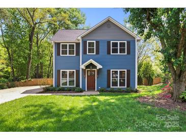 Charming two-story home with blue siding, brown shutters, and a well-manicured lawn at 1536 Bear Mountain Rd, Charlotte, NC 28214