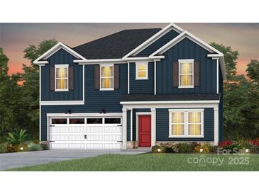 Two-story home with navy siding, white trim, a red front door, and an attached garage at 13752 Roderick Dr # 175, Huntersville, NC 28078