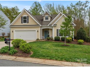 Charming single-Gathering home showcasing a manicured lawn and a classic architectural design at 1669 Beleek Ridge Ln, Clover, SC 29710