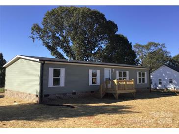 Charming single-story home with a covered entryway and a manicured lawn at 3925 Taylorsville Hwy, Statesville, NC 28625