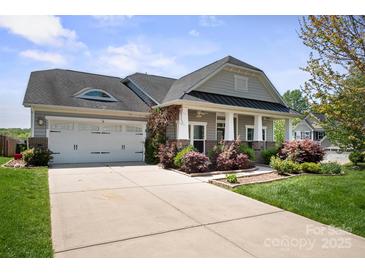 Charming single-story home with a two-car garage, inviting front porch, and well-maintained landscaping at 4006 Fall Oak Ter, Fort Mill, SC 29707