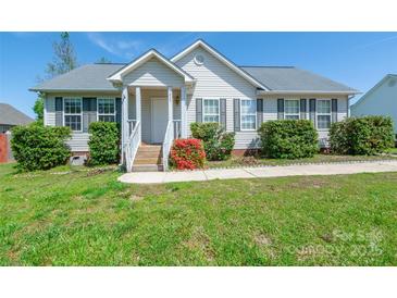 Charming single-story home featuring a welcoming front porch and well-maintained landscaping with lush shrubs at 1805 Lawton Dr, Rock Hill, SC 29730