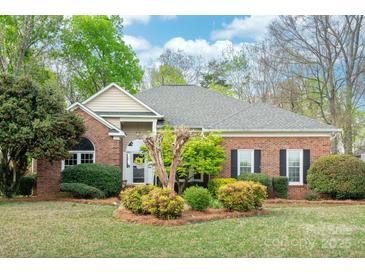 Charming brick home with well-maintained landscaping and mature trees at 3866 Bethany Nw Ct, Concord, NC 28027