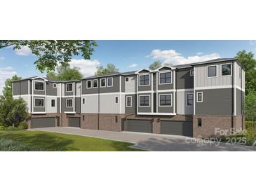 Stylish townhome showcases a two-car garage, brick accents, and a modern design with neutral colors at 8929 Sharonbrook Dr, Charlotte, NC 28210