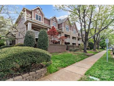 Inviting exterior showcasing a multi-story home with a sidewalk, landscaping, and charming architectural details at 333 Circle Ave # F, Charlotte, NC 28208
