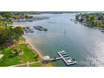 Stunning aerial view of a waterfront property with a private dock and boat access on a beautiful lake at 7836 Village Harbor Dr, Cornelius, NC 28031