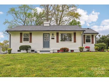 Charming, renovated single-story home featuring updated landscaping and a freshly painted exterior at 2138 Syracuse Dr, Charlotte, NC 28216