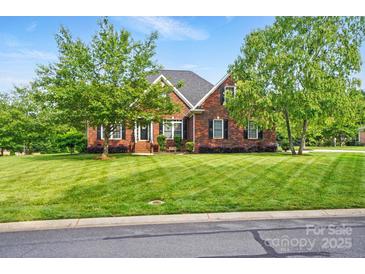 Charming brick home featuring a well-manicured lawn and mature trees in a desirable neighborhood at 3011 Patrick Place Cir, Clover, SC 29710