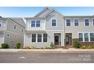 Charming two-story townhome with a mix of traditional and modern design elements, nestled in a friendly neighborhood at 562 Amalfi Dr, Davidson, NC 28036